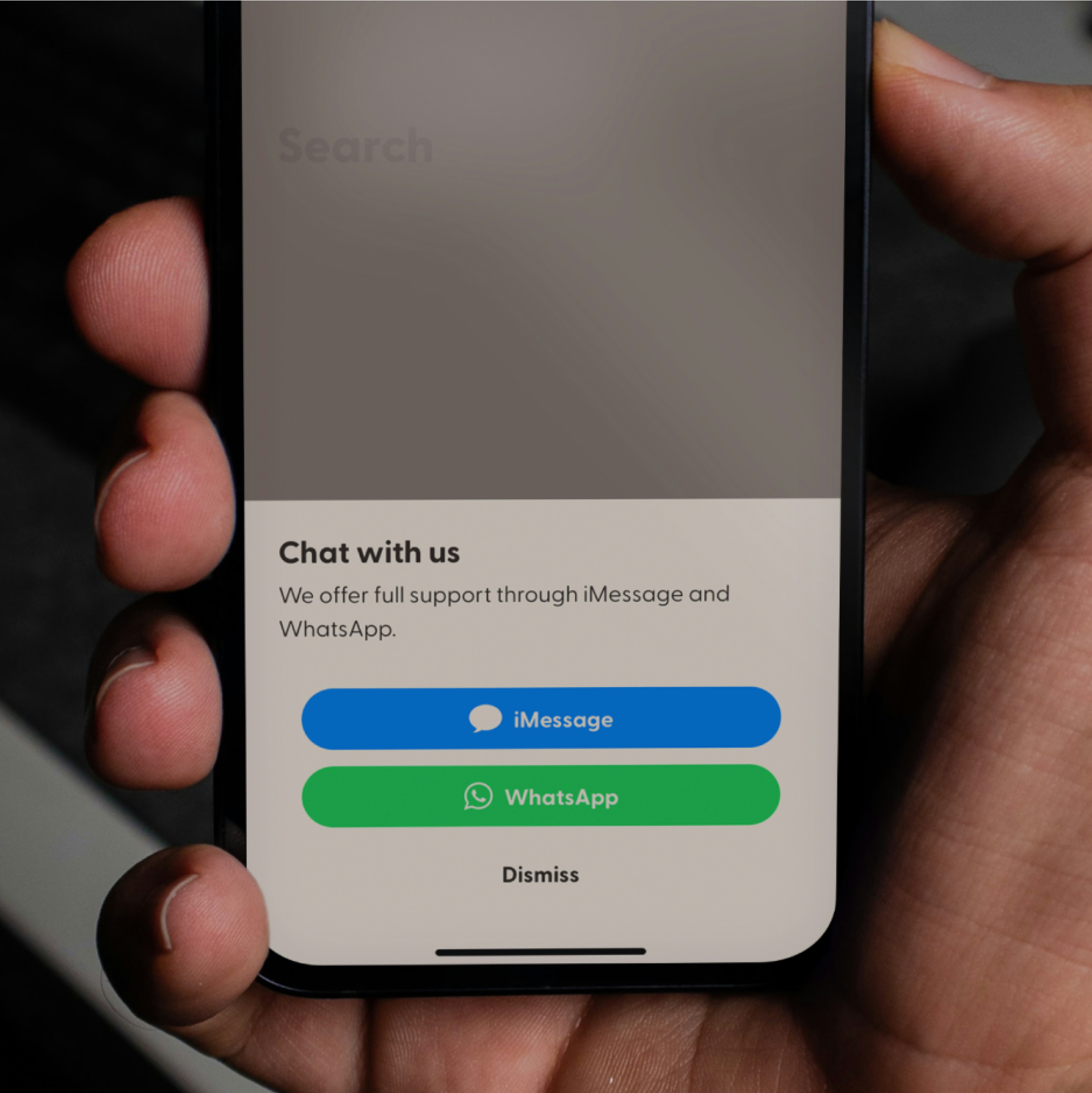 Smartphone showing missed call text back interface with neon city lights background